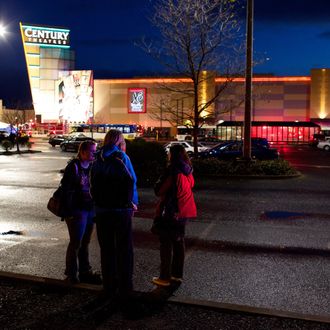 People stand in front of Clackamas Town Center mall after a shooting on December 11, 2012 in Clackamas, Oregon. According to reports, two victims and the gunman are dead after emergency dispatchers received reports that a shooting had occurred and a man was seen with an assault rifle near the mall's food court around 3:29 p.m. 