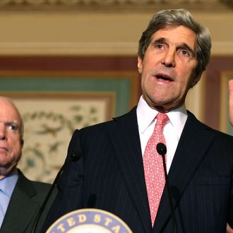 Senate Foreign Relations Chairman John Kerry (D-MA) (R), and Sen. John McCain (R-AZ) (L) participate in a news conference with people who have disabilities on Capitol Hill, December 3, 2012 in Washington, DC. Sen. Senate Foreign Relations Chairman John Kerry (D-MA) urged fellow Senators to approve the 