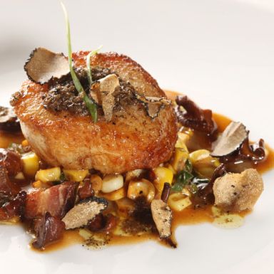Seared scallop, sweet late summer corn, chanterelles, and lardons finished with a tapenade of anchovy, olive oil, garlic and fall Burgundian black truffles.