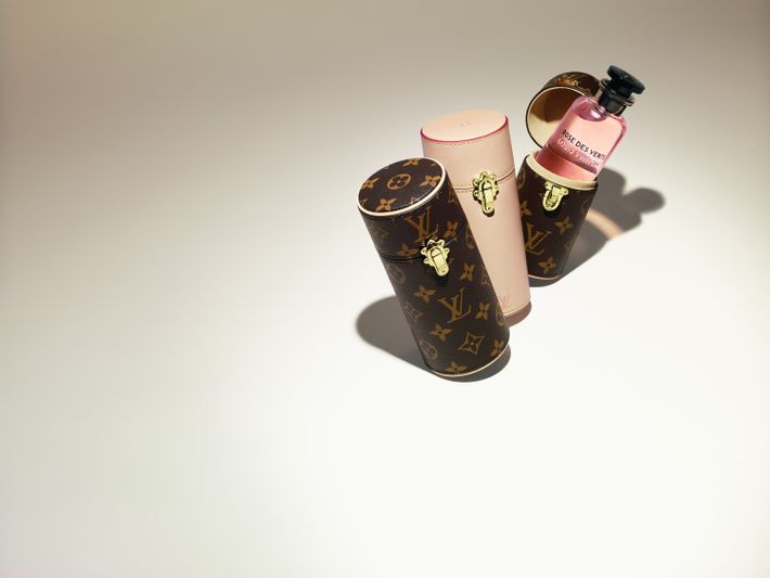 Louis Vuitton, a monogram perfume travel case, designed in a cylindrical  shape with the maker's sign