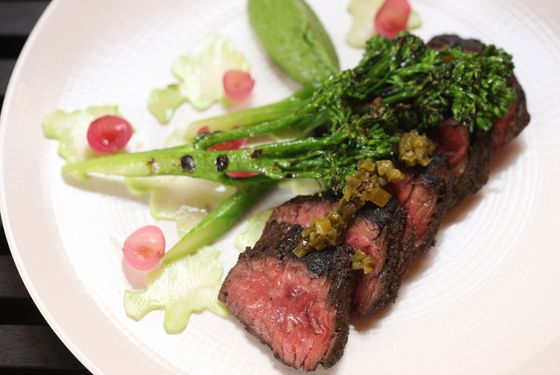 Grass-fed hanger steak with charred broccoli and green sauce.