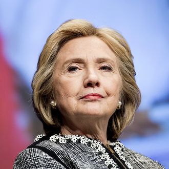 Former Secretary of State Hillary Clinton waits to speak at the World Bank May 14, 2014 in Washington, DC. Clinton and World Bank President Jim Yong Kim joined others to speak about women's rights.