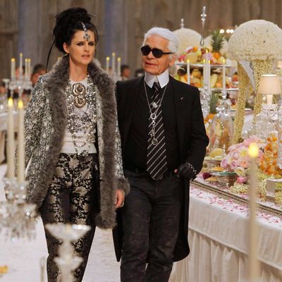 Karl with Stella Tennant on the runway of his pre-fall show.