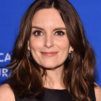 Actress Tina Fey poses at the Brahmin booth during the HBO Luxury News  Photo - Getty Images