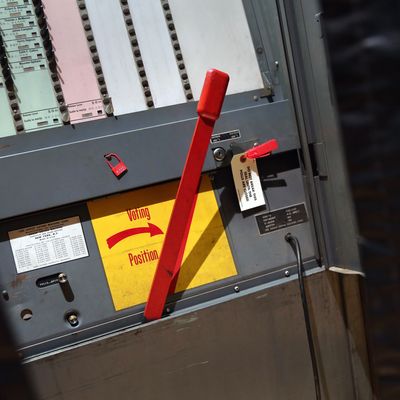  A manual voting machine awaits voters to cast their ballots in the mayoral primary election on September 10, 2013 in the Manhattan borough of New York City. Voters had a wide range of candidates to choose from in a primary vote ahead of the upcoming election to replace outgoing Mayor Michael Bloomberg. 