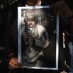 A demonstrator holds an image of ousted Venezuelan President Nicolas Maduro in U.S. custody, during a protest in Mexico City, Mexico, on Saturday.
