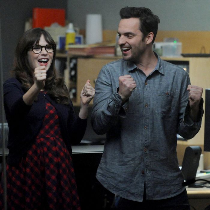 NEW GIRL: Jess (Zooey Deschanel, L) and Nick (Jake Johnson, R) are excited when Coach and May reconcile in the 