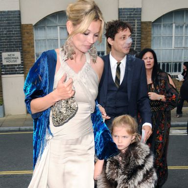 LONDON - JUNE 21: Kate Moss and daughter Lila Moss attend  Leah Wood and Jack MacDonald’s Wedding on June 21, 2008 in London, England.  (Photo by Sylvia Linares/FilmMagic)