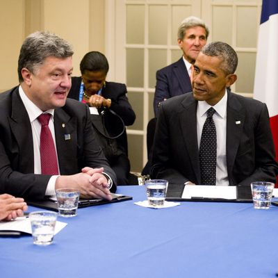 (From L-R) Ukrainian President Petro Poroshenko, US President Barack Obama, British Prime Minister David Cameron and Italian Prime Minister Matteo Renzi hold a meeting on the situation in Ukraine at the Celtic Manor Resort during the 2014 NATO Summit, in Newport, Wales, on September 4, 2014. 