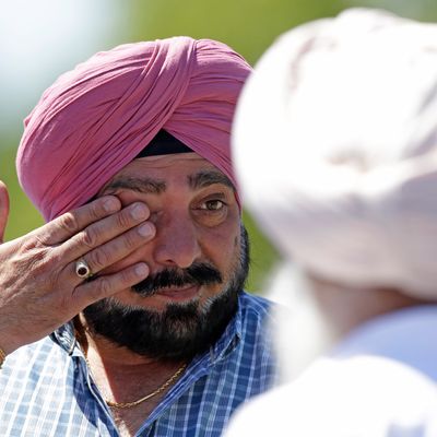 A man wipes away tears outside the Sikh Temple in Oak Creek, Wis. where a shooting took place on Sunday, Aug 5, 2012. A man wipes away tears outside the Sikh Temple in Oak Creek, Wis. where a shooting took place on Sunday, Aug 5, 2012. (AP Photo/Jeffrey Phelps)