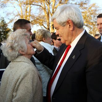 Republican presidential candidate, former House Speaker Newt Gingrich, pinches the nose of Bonnie Ellison, 78, of Easley, S.C. while shaking hands with supporters at Mutt's Barbeque in Easley, S.C. Wednesday, Jan. 18, 2012.