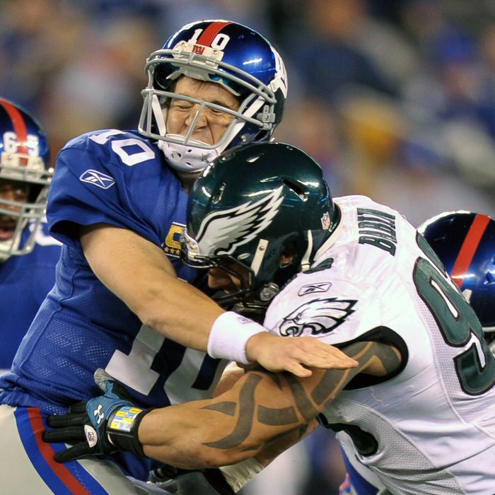 EAST RUTHERFORD, NJ - NOVEMBER 20: Eli Manning #10 of the New York Giants is hit by Jason Babin #93 of the Philadelphia Eagles at MetLife Stadium on November 20, 2011 in East Rutherford, New Jersey. (Photo by Drew Hallowell/Philadelphia Eagles/Getty Images)