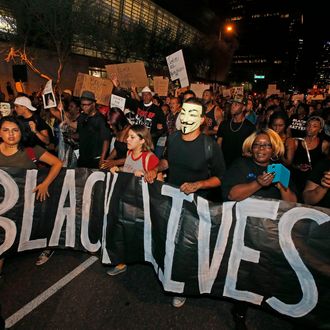 Marchers numbering nearly 1,000 take to the streets to protest against the recent fatal shootings of black men by police Friday, July 8, 2016, in Phoenix. Freeway ramps were closed and pepper spray and tear gas were used Friday night during a protest in downtown Phoenix following the killings of black men in Baton Rouge, Louisiana, and suburban St. Paul, Minnesota, at the hands of police and the deadly sniper attack on police officers in Dallas. (AP Photo/Ross D. Franklin)