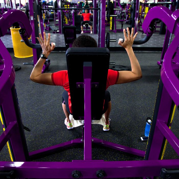 Cristina Winsor, of Wakefield, works out at Planet Fitness in Reading on Tuesday, March 19, 2013. 