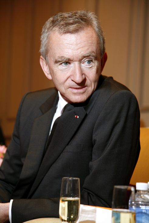 French President Francois Hollande, LVMH CEO Bernard Arnault and