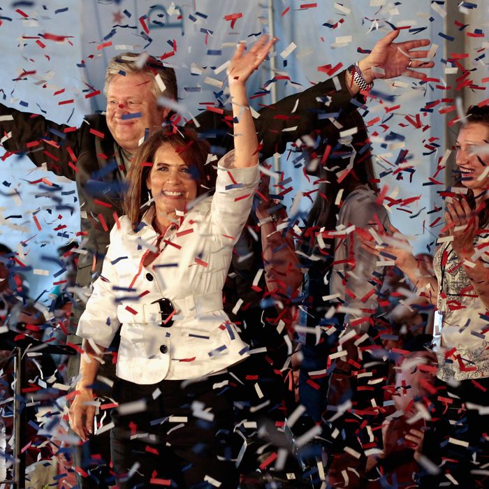 Republican presidential candidate Rep. Michele Bachmann (R-MN), her husband Marcus Bachmann and some of their children wave to supporters as confetti rains down in her tent outside the Hilton Coliseum at Iowa State University August 13, 2011 in Ames, Iowa. Nine GOP presidential candidates are competing for votes in the Iowa Straw Poll, an important step for gaining momentum in a crowded field of hopefuls. 