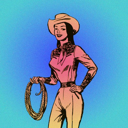 Portrait of young cowgirl posing with lasso in hand