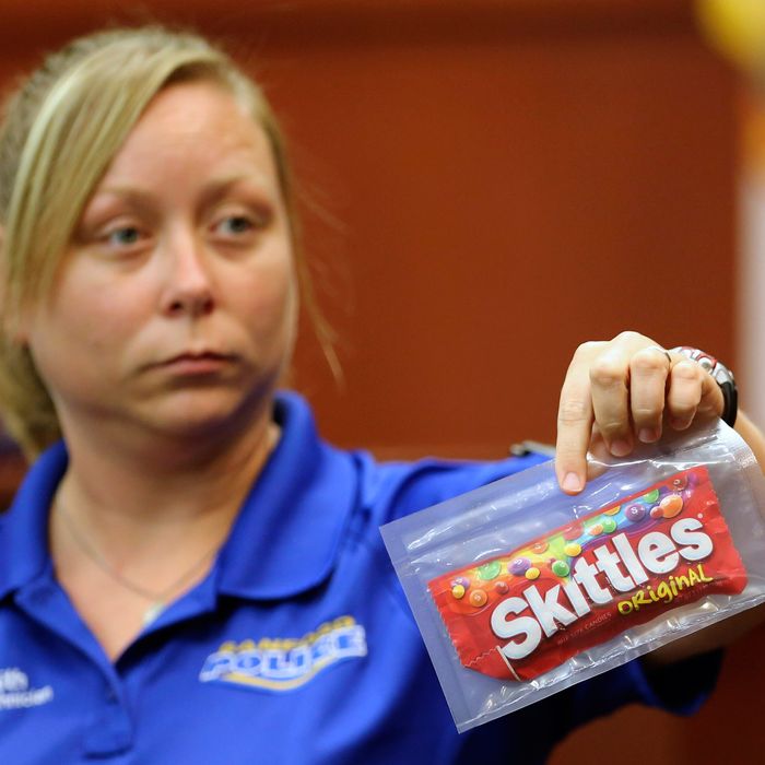 Diana Smith, crime scene technician for the Sanford Police Department, shows the jury a bag of Skittles that was collected as evidence at the crime scene, during George Zimmerman's trial in Seminole circuit court June 25, 2013 in Sanford, Florida. Zimmerman is charged with second-degree murder for the February 2012 shooting death of 17-year-old Trayvon Martin.