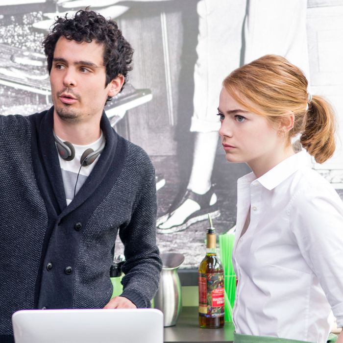 Director Damien Chazelle and Emma Stone on the set of LA LA LAND.