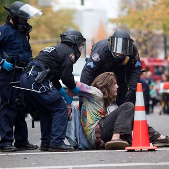 PORTLAND - NOVEMBER 13: A young protester is arrested near the Occupy Portland encampment November 13, 2011 in Portland, Oregon. Portland police have reclaimed the two parks in which occupiers have been camping after a night of brinksmanship with protesting crowds of several thousands. (Photo by Natalie Behring/Getty Images)