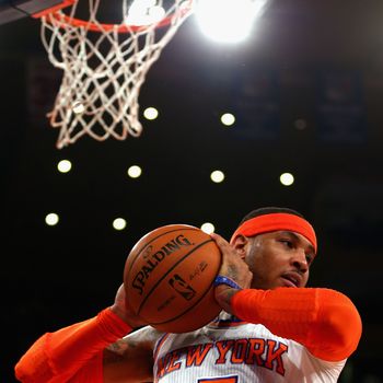 NEW YORK, NY - MAY 16: Carmelo Anthony #7 of the New York Knicks rebounds the ball against the Indiana Pacers during Game Five of the Eastern Conference Semifinals of the 2013 NBA Playoffs at Madison Square Garden on May 16, 2013 in New York City. NOTE TO USER: User expressly acknowledges and agrees that, by downloading and or using this photograph, User is consenting to the terms and conditions of the Getty Images License Agreement. (Photo by Elsa/Getty Images)