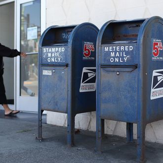 A U.S. Postal Service customer enters the Bayview Station on July 26, 2011 in San Francisco, California. The U.S. Postal Service announced plans to cut up to 3,700 of its 32,000 post offices across the country as they seek ways to cut financial losses as mail volume dwindles.