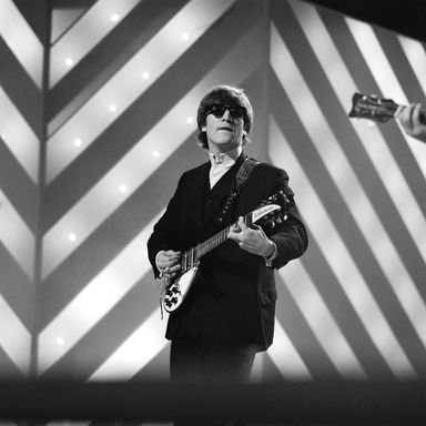 John Lennon jamming, with shades, at Teddington Studios.