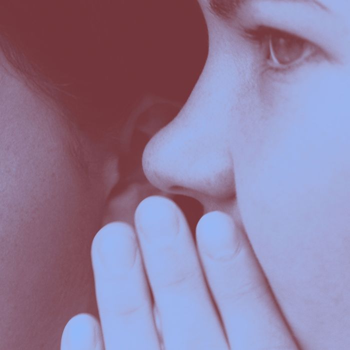 Teen Whispering Secret to Friend --- Image by ? Bob Mitchell/CORBIS