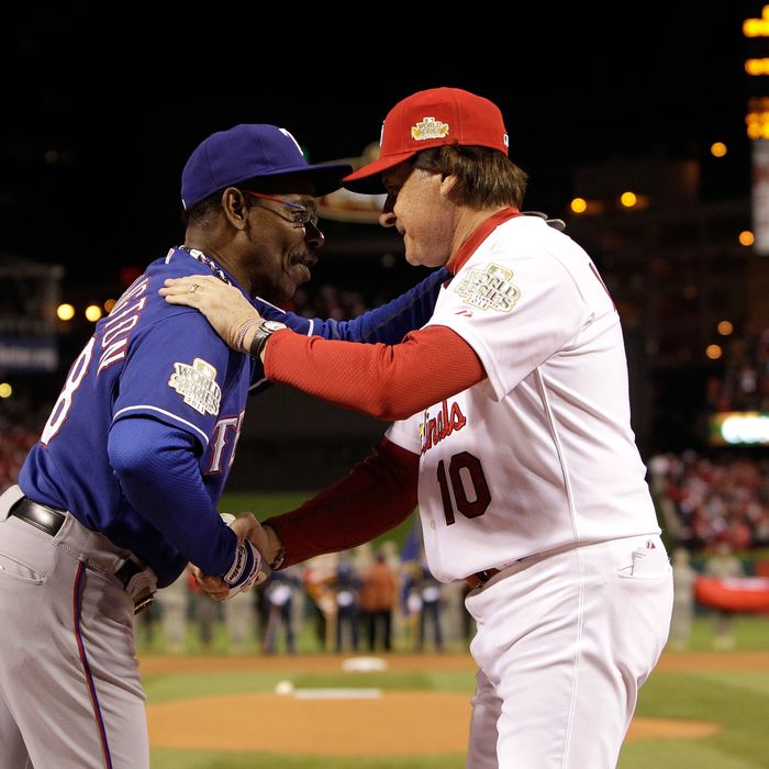 ST LOUIS, MO - OCTOBER 19: (L-R) Manager Ron Washington #38 of the Texas Rangers and manager Tony La Russa #10 of the St. Louis Cardinals and shake hands prior to the start of Game One of the MLB World Series at Busch Stadium on October 19, 2011 in St Louis, Missouri. (Photo by Paul Sancya-Pool/Getty Images)