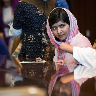 Malala Yousafzai, the 16-year-old Pakistani advocate for girls education who was shot in the head by the Taliban, attends a conversation with the United Nations Secretary General Ban-ki Moon Ban-ki Moon and other youth delegates at the United Nations Youth Assembly on July 12, 2013 in New York City. The United Nations declared July 12 