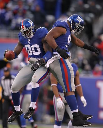 EAST RUTHERFORD, NJ - DECEMBER 05: Jason Pierre-Paul #90 of the New York Giants celebrates running with Justin Tuck after running back a fumble by the Washington Redskins during their game on December 5, 2010 at The New Meadowlands Stadium in East Rutherford, New Jersey. (Photo by Al Bello/Getty Images) *** Local Caption *** Jason Pierre-Paul;Justin Tuck