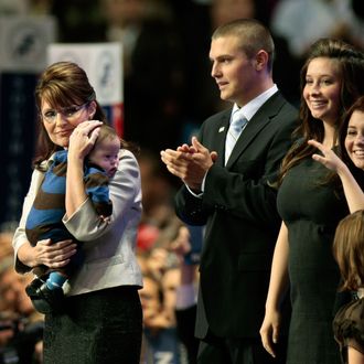 ST. PAUL, MN - SEPTEMBER 03: (L to R) Republican U.S vice-presidential nominee Alaska Gov. Sarah Palin holds her son Trig Palin as Track Palin, Bristol Palin and Willow Palin look on during day three of the Republican National Convention (RNC) at the Xcel Energy Center on September 3, 2008 in St. Paul, Minnesota. The GOP will nominate U.S. Sen. John McCain (R-AZ) as the Republican choice for U.S. President on the last day of the convention. (Photo by Win McNamee/Getty Images)
