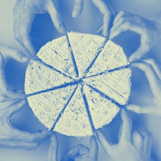 Group of eight people reaching for slice of cake, close-up, overhead view