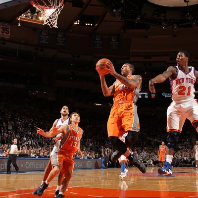 Shannon Brown #26 of the Phoenix Suns goes to the basket against Iman Shumpert #21 of the New York Knicks during the game on January 18, 2012 at Madison Square Garden in New York City.