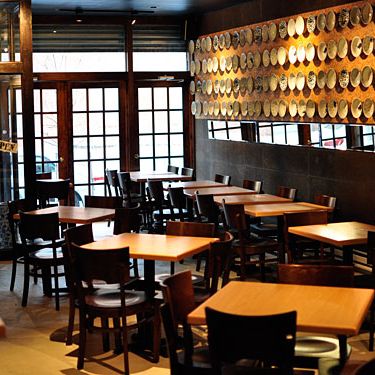 A friend helped the owners design the space, which includes a huge section of wall-mounted noodle bowls on cork.