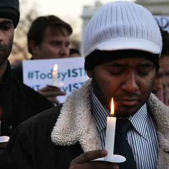 Faisal Ali (R) of Colorado Springs, Colorado, joins other people outside the White House to participate in a candle light vigil to remember the victims at the Sandy Hook Elementary School shooting in Newtown, Connecticut on December 14, 2012 in Washington, DC. According to reports, there are about 27 dead, 20 of them children, after a gunman opened fire in at the Sandy Hook Elementary School. The shooter was also killed.WASHINGTON, DC - DECEMBER 14: Faisal Ali (R) of Colorado Springs, Colorado, joins other people outside the White House to participate in a candle light vigil to remember the victims at the Sandy Hook Elementary School shooting in Newtown, Connecticut on December 14, 2012 in Washington, DC. According to reports, there are about 27 dead, 20 of them children, after a gunman opened fire in at the Sandy Hook Elementary School. The shooter was also killed. (Photo by Alex Wong/Getty Images)