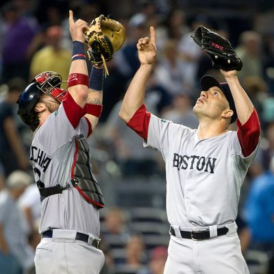 NEW YORK, NY - JULY 29: Alfredo Aceves #91 (R) and Jarrod Saltalamacchia #39 of the Boston Red Sox react after defeating the New York Yankees at Yankee Stadium on July 29, 2012 in the Bronx borough of New York City. (Photo by Christopher Pasatieri/Getty Images)