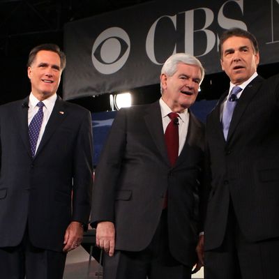 SPARTANBURG, SC - NOVEMBER 12: Republican presidential candidates (L-R) businessman Herman Cain, former Massachusetts Governor Mitt Romney, former Speaker of the House Newt Gingrich (R-GA), and Texas Governor Rick Perry acknowledge audience prior to a presidential debate at Wofford College November 12, 2011 in Spartanburg, South Carolina. The debate was focused on national security and foreign policy. (Photo by Alex Wong/Getty Images)