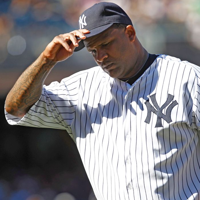 CC Sabathia #52 of the New York Yankees reacts as he walks to the dugout during their game against the Toronto Blue Jays at Yankee Stadium on August 29, 2012 in the Bronx borough of New York City. 