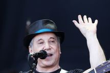 GLASTONBURY, ENGLAND - JUNE 26:  (UK TABLOID NEWSPAPERS OUT) Paul Simon performs on the Pyramid Stage at the Glastonbury Festival at Worthy Farm, Pilton on June 26, 2011 in Glastonbury, England. The festival, which started in 1970 when several hundred hippies paid 1 GBP to watch Marc Bolan, has grown into Europe's largest music festival attracting more than 175,000 people over five days.  (Photo by Dave Hogan/Getty Images)