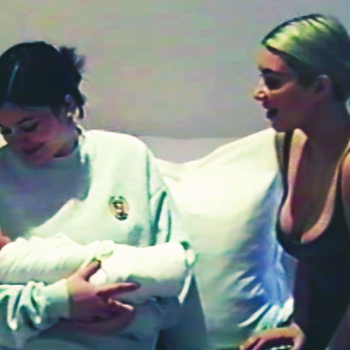 Kylie Jenner holds Chicago West, Kim and Kanye's two-week-old daughter.