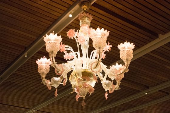 The flower-shaped chandeliers are made of Murano glass.