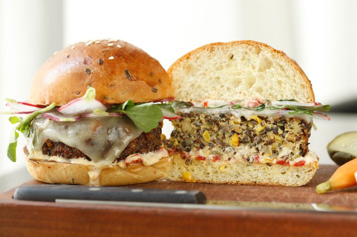 The patty is a combination of quinoa, lentils, chickpeas, and charred corn.