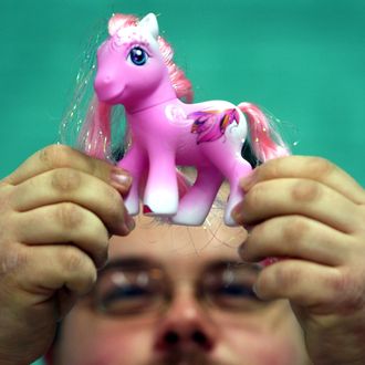 BRISTOL, UNITED KINGDOM - OCTOBER 26: Chris Sallis from Sheffield looks at a special edition My Little Pony at the International My Little Pony Convention at Redwood Hotel and Country Club, near Bristol on October 26 2007 in England. Fans of the toys were in the city to celebrate twenty five years Of My Little Pony. (Photo by Matt Cardy/Getty Images)