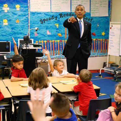 U.S. President Barack Obama visits the classroom of teacher Elizabeth Slagal, during a visit to the Clarence Tinker elementary schoolchildren while at MacDill Air Force Base in Tampa, Florida, September 17, 2014. REUTERS/Larry Downing (UNITED STATES - Tags: POLITICS MILITARY EDUCATION) --- Image by ? LARRY DOWNING/Reuters/Corbis