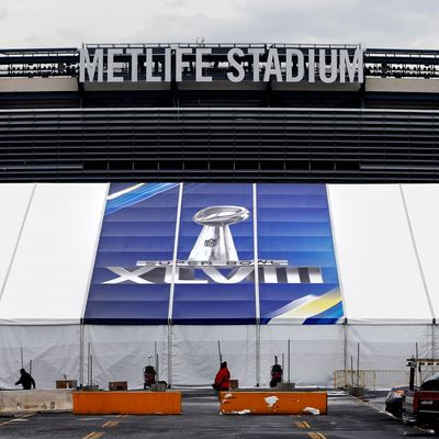 MetLife Stadium stands behind a Super Bowl sign as the venue is prepared to host Super Bowl XLVIII between the Denver Broncos and the Seattle Seahawks January 27, 2014 in East Rutherford, New Jersey. 