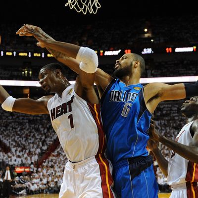 MIAMI, FL - JUNE 12: Chris Bosh #1 of the Miami Heat and Tyson Chandler #6 of the Dallas Mavericks fight for control of the ball in the first half of Game Six of the 2011 NBA Finals at American Airlines Arena on June 12, 2011 in Miami, Florida. NOTE TO USER: User expressly acknowledges and agrees that, by downloading and/or using this Photograph, user is consenting to the terms and conditions of the Getty Images License Agreement. (Photo by Don Emmert-Pool/Getty Images)