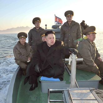 In this March 11, 2013 photo released by the Korean Central News Agency (KCNA) and distributed March 12, 2013 by the Korea News Service, North Korean leader Kim Jong Un rides on a boat, heading for the Wolnae Islet Defense Detachment, North Korea, near the western sea border with South Korea. North Korea's young leader urged front-line troops to be on 