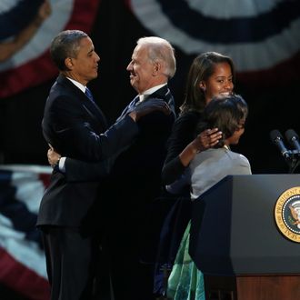 CHICAGO, IL - NOVEMBER 06: U.S. President Barack Obama and U.S. Vice President Joe Biden embrace on stage with family after his victory speech on election night at McCormick Place November 6, 2012 in Chicago, Illinois. Obama won reelection against Republican candidate, former Massachusetts Governor Mitt Romney. (Photo by Win McNamee/Getty Images)