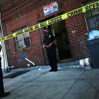 Police stand near the scene of a murder in New York